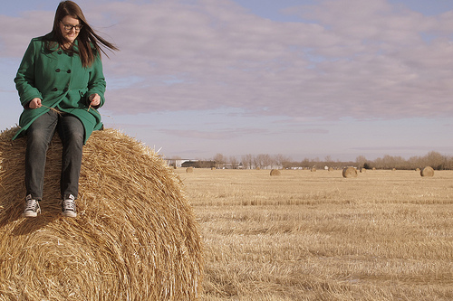 Jess on a bale of hay near Calgary Alberta